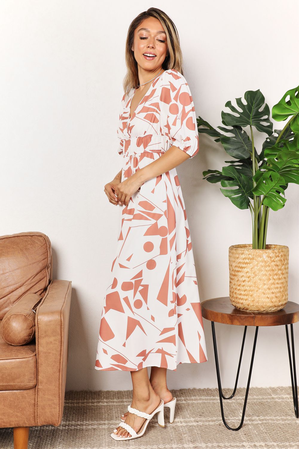 Printed surplice balloon sleeve midi dress in camel with pink floral print, model front view
