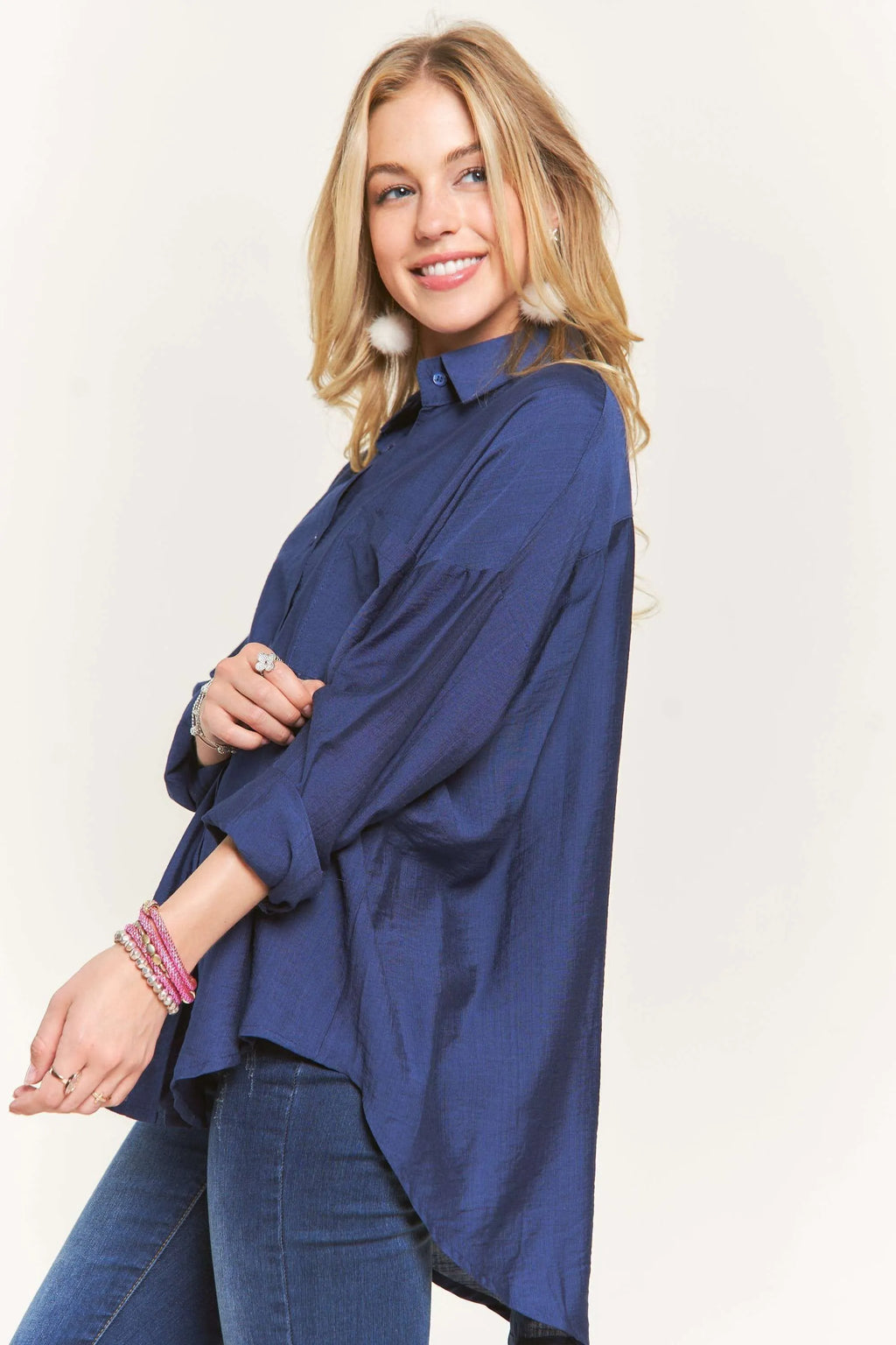 "Model in the ADORA navy linen button-down shirt, side view"