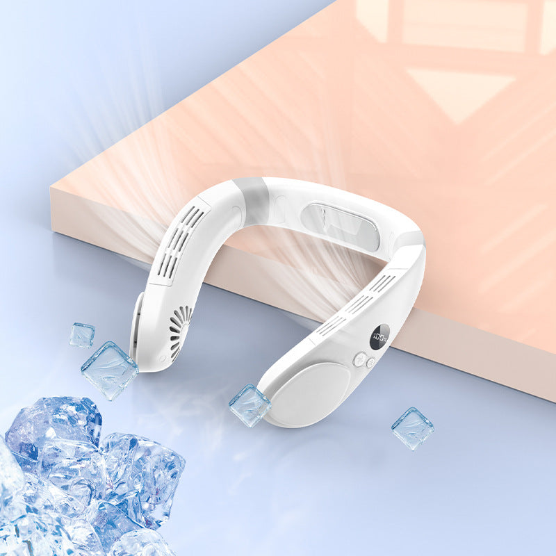 White wearable neck fan on a blue surface beside decorative ice and a peach-colored backdrop.