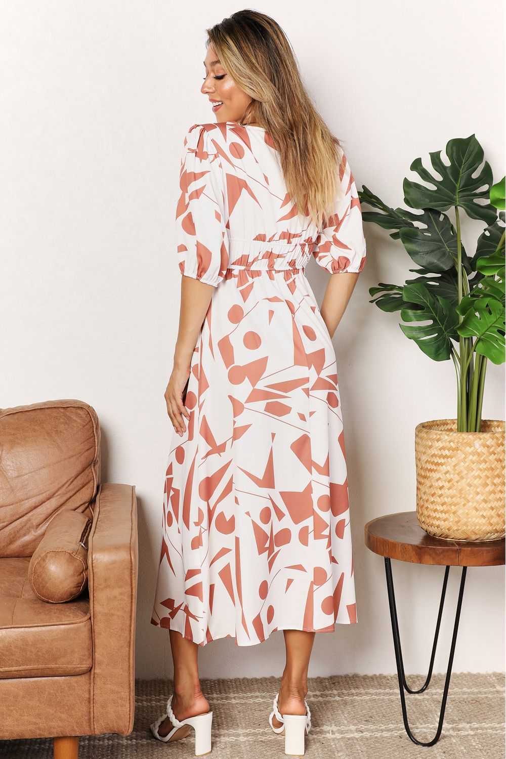 Printed surplice balloon sleeve midi dress in camel with pink floral print, back view