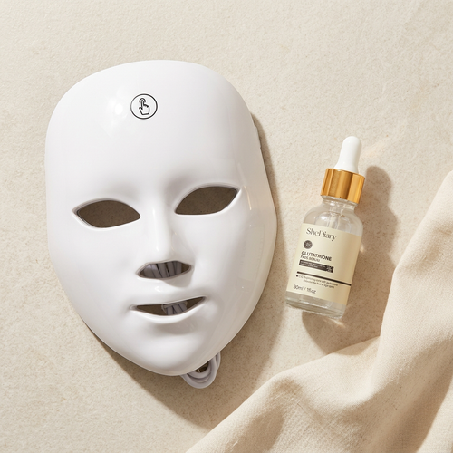 White photon mask and SheDiary serum flat-lay